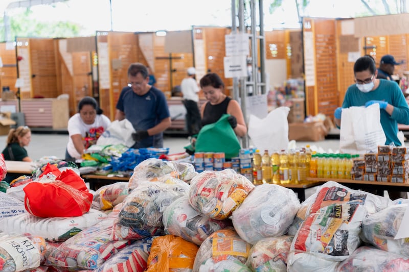 Volunteers help prepare 1,000 food kits for distribution to various areas affected by an earthquake in Cali, Colombia, in August 2026.