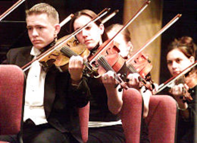 Members of Ricks College Symphony Orchestra perform latest offering in school's biennial Sacred Musi
