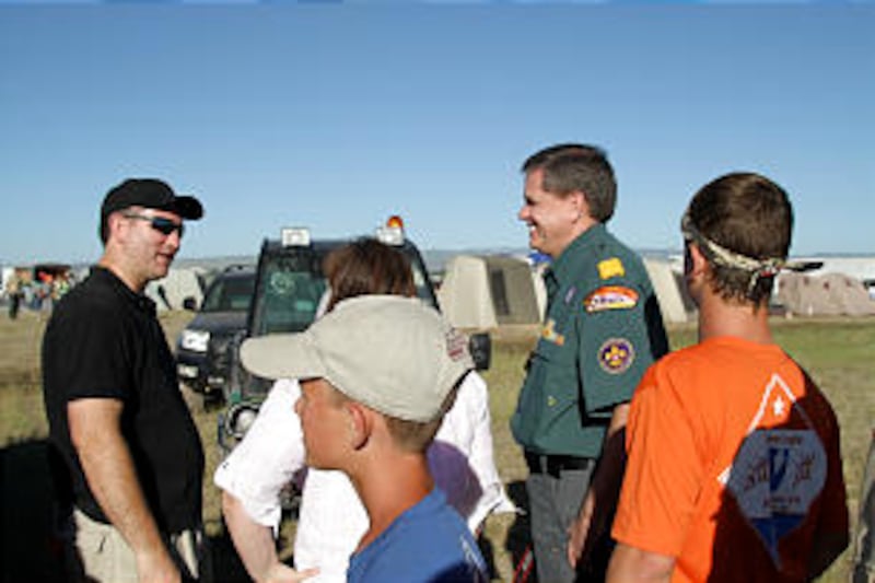 Young Men general president David L. Beck visits with Scouts and leaders at the 2013 Rise Up Scout C