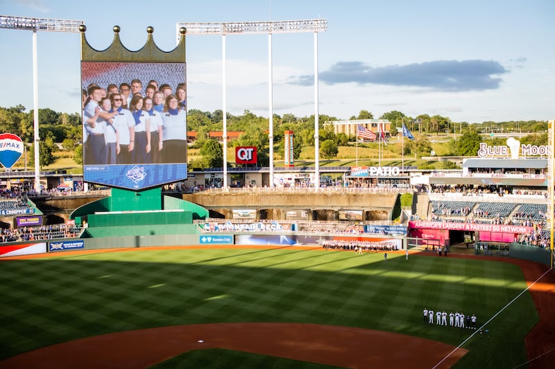The Kansas City Royals video board shows some of the 150 missionaries from the Church's Missouri Independence Mission who sang the United States national anthem, at a Royals' baseball game on Tuesday, August 6, 2024.