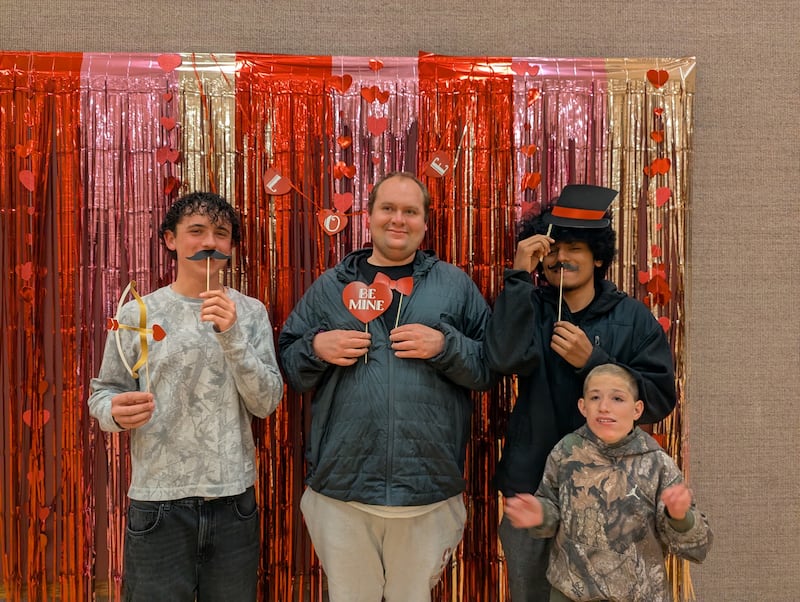 Disability activity program participants take Valentine's Day pictures during an event in Las Vegas, Nevada, in Februrary 2026.