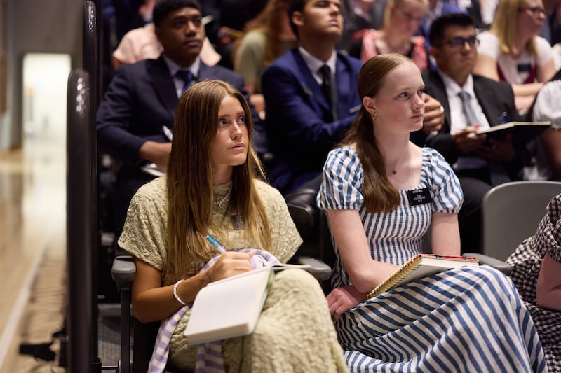 Missionaries listen to Elder Gerald Caussé speak during a devotional meeting at the Provo Missionary Training Center.
