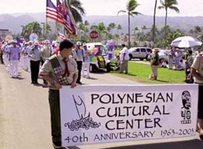 Scouts lead Laie community parade celebrating center's anniversary.