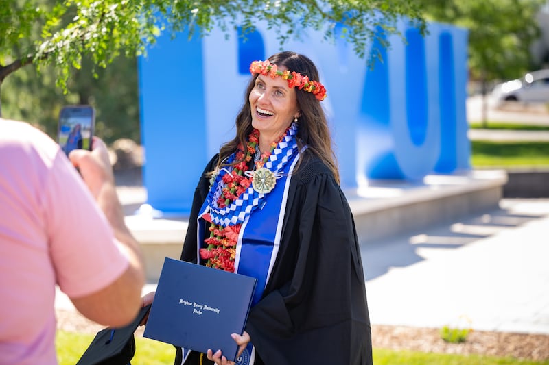 Graduates pose for photos outside the BYU–I Center following commencement on Thursday, July 23, 2026, in Rexburg, Idaho.