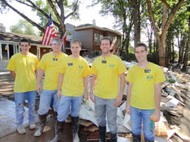 From left, Nathan Plymell, Elders Koherhans, Cushion, Drabandt and Johnson help clean up after the f