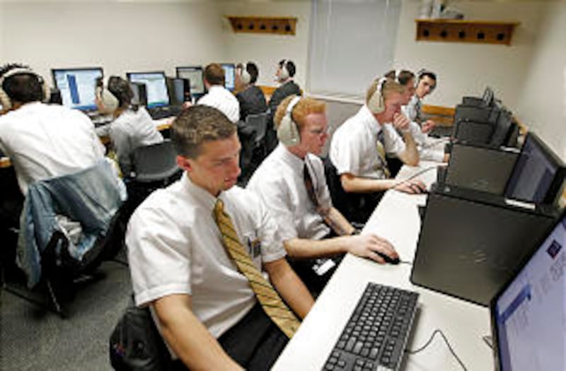 Missionaries use computer to help master their language skills.