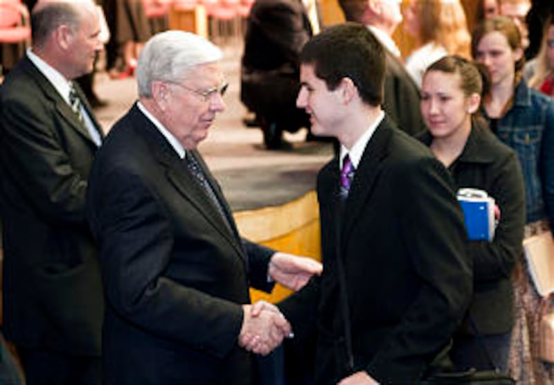 Elder Ballard greets a BYU-Idaho student at the Jan. 30 fireside.