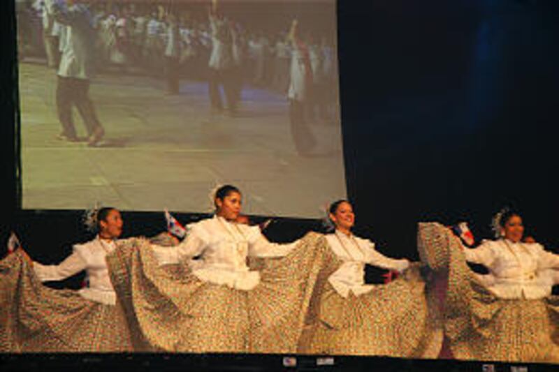 With a big screen overhead, young flag-bearing dancers perform the opening selection "Viva Panama!"