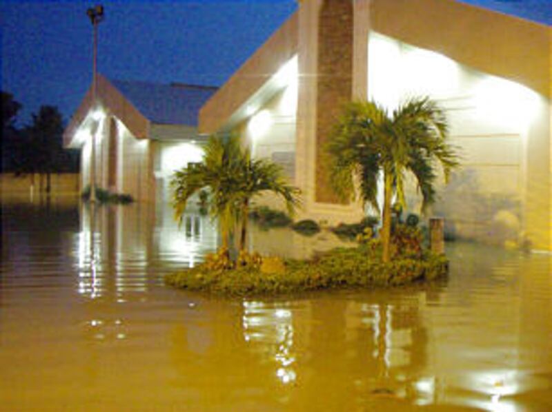 Flood waters surround the Pasig Philippines Stake center. Devastating floods in the Manila, Philippi