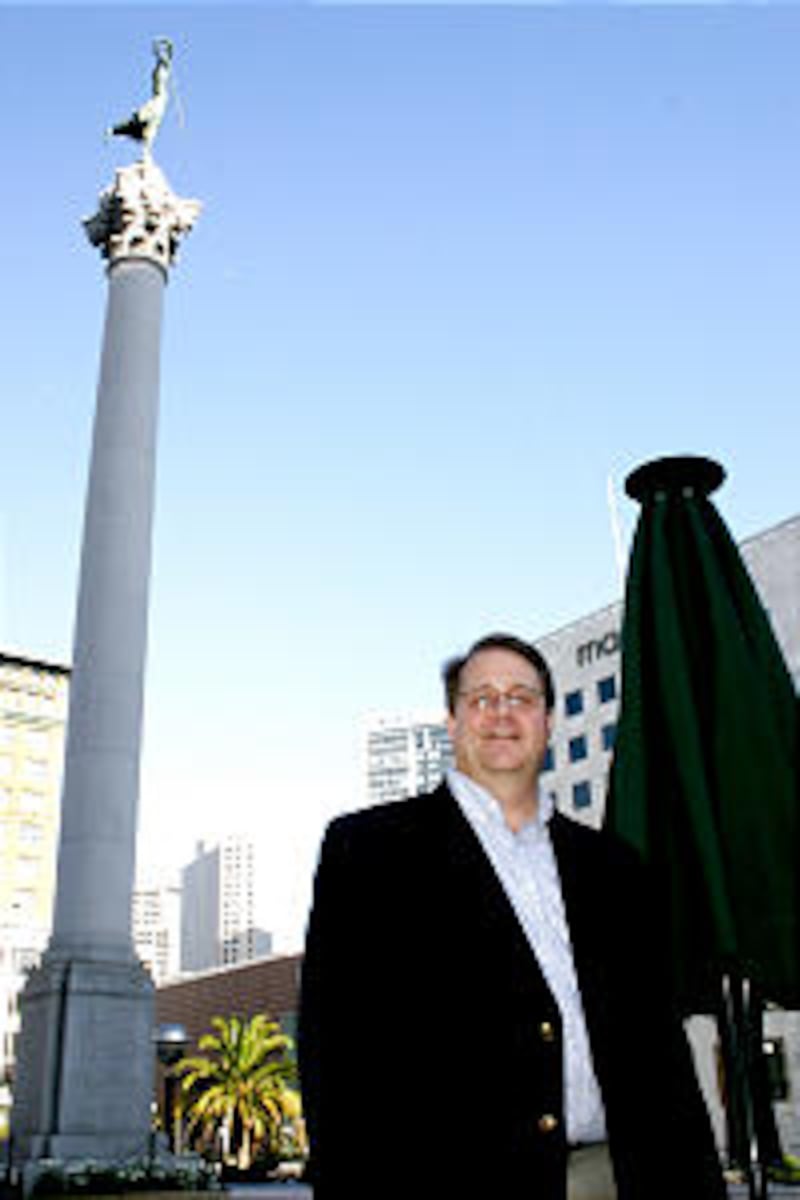Bishop Roger Curtis, in San Francisco's Union Square near his workplace, presides over the Sunset Wa