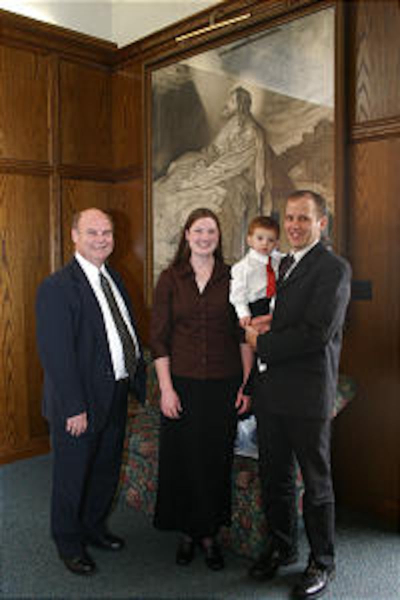 San Francisco California West Stake President Ronald E. Dillender, left, visits with Angela and Teko