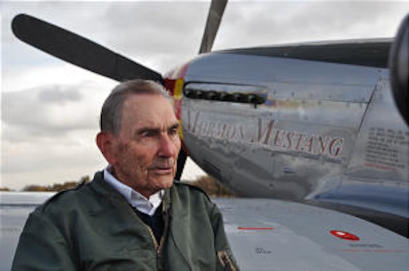 Brigadier General Roland Wright stands in front of a P-51 Mustang in Rexburg, Idaho Oct. 23, 2009. T