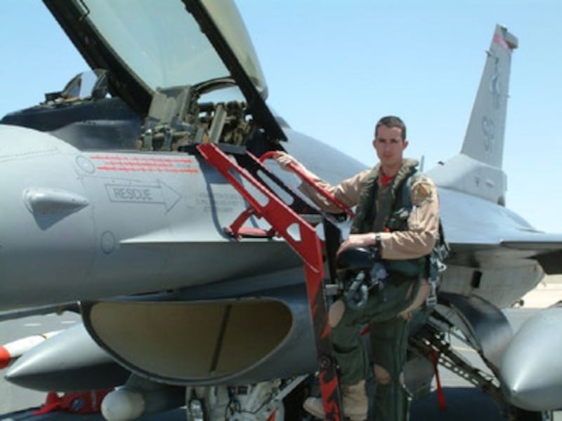 Award-winning pilot Major Derek "Maestro" O'Malley climbs into a fighter jet.