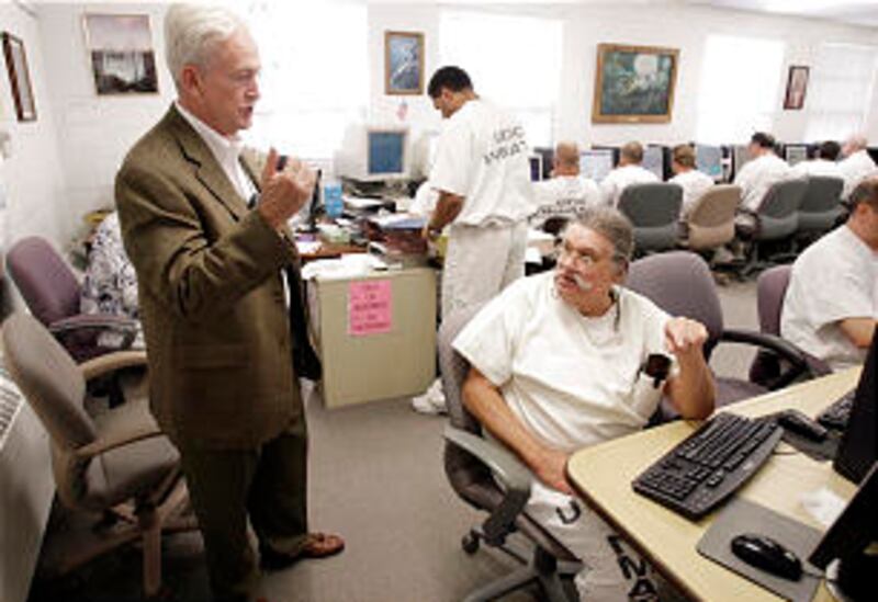 Director Edward Lund speaks with inmate Austin Sumner.