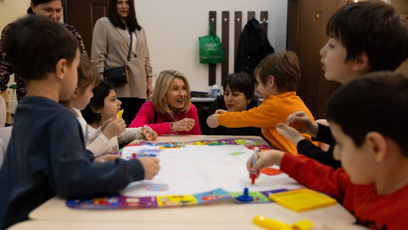 President Camille N. Johnson interacts with children at the Children of the Sun daycare center in Tbilisi, Georgia, on Wednesday, March 4, 2026.