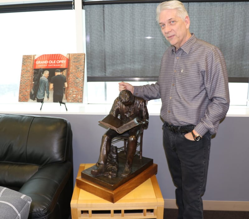USANA CEO Kevin Guest’s West Valley City, Utah, office includes a photo commemorating his performance at the Grand Ole Opry and a sculpture of young Joseph Smith seeking wisdom in the scriptures.