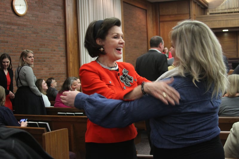 Sister Kristin Oaks embraces Ashley Lawson before a Holladay Region Mid-Single Adult Fireside on Jan. 13, 2019.