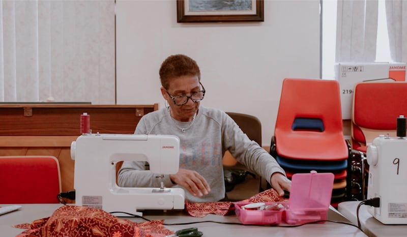 Rachel Abeson sews during a February 2024 class held at the Wembley Friendship and Outreach Center.