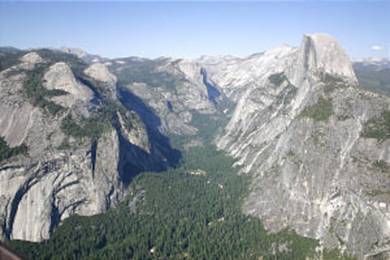 In an expanse of granite splendor, Half Dome towers over Yosemite, home to wildlife and scenic wonde