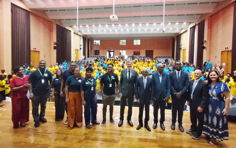 Country and city leaders stand with Church leaders on the stage in front of hundreds of youth at the opening ceremony of For the Strength of Youth sessions in Praia, Cape Verde, Aug. 17, 2026.