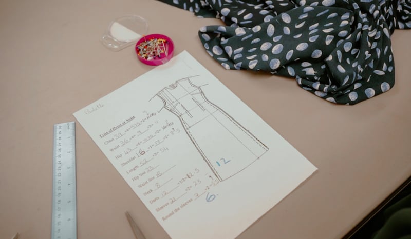 Measurements for a dress being self-drafted is photographed during a February 2024 beginner sewing class at the Wembley Friendship and Outreach Center.