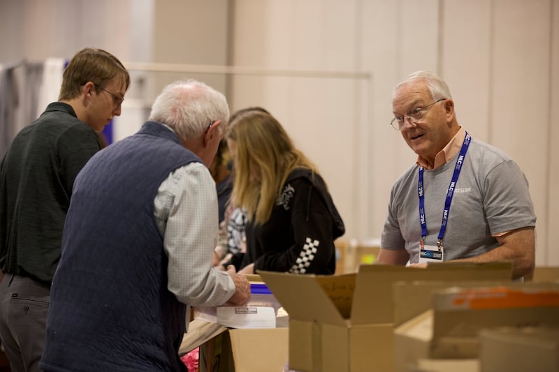 Volunteers assemble hygiene kits for a JustServe project at the National League of Cities summit in Salt Lake City on Thursday, Nov. 20, 2025.