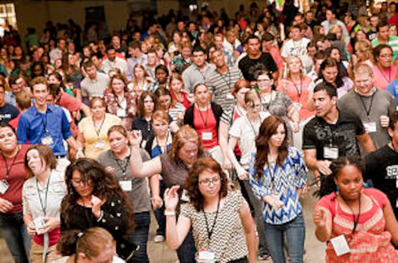 Young single adults from Durham pack the Cabarrus Arena in Charlotte, N.C. for a Friday night concer