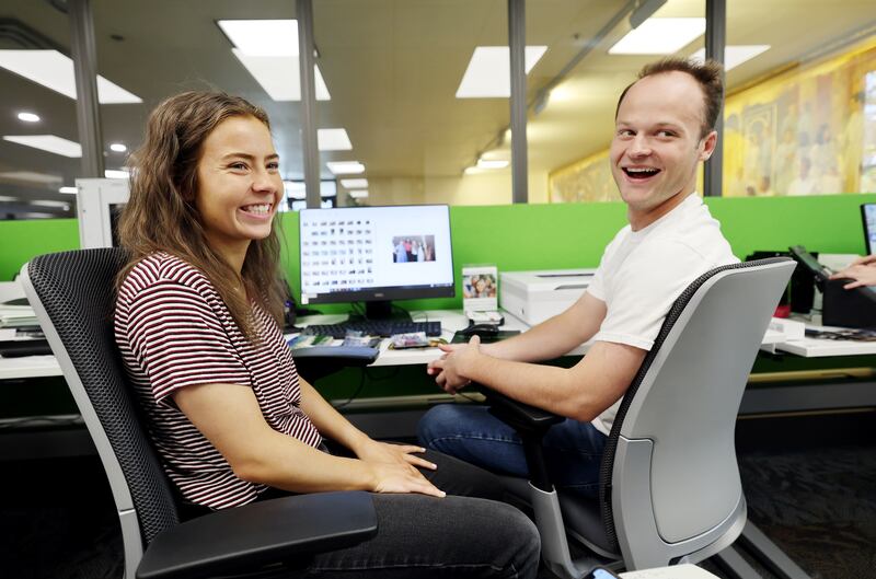 Mary Hallman and Bailey Jensen sit at computers at the new Family Memories Preservation Center