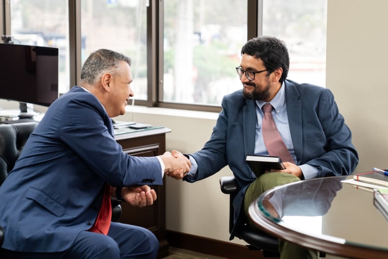 Elder Juan Pablo Villar, a General Authority Seventy and president of the Church’s South America Northwest Area, left, shakes hands with José Fernando Reyes, a Peruvian government official, after giving him a copy of the Book of Mormon in Lima, Peru, on Feb. 3, 2026.