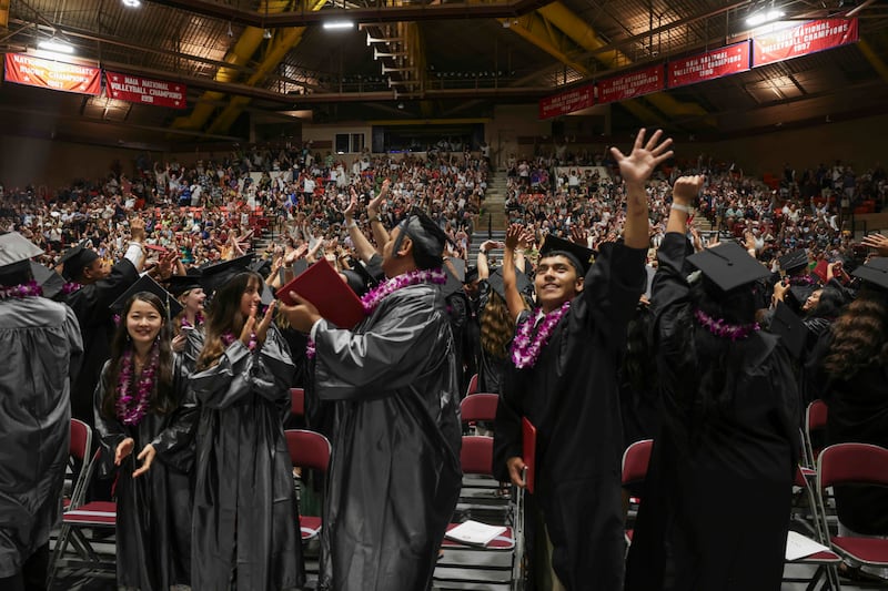 BYU–Hawaii graduates wave to their loved ones during commencement held in the Cannon Activities Center on Friday, April 17, 2026, in Laie, Hawaii.