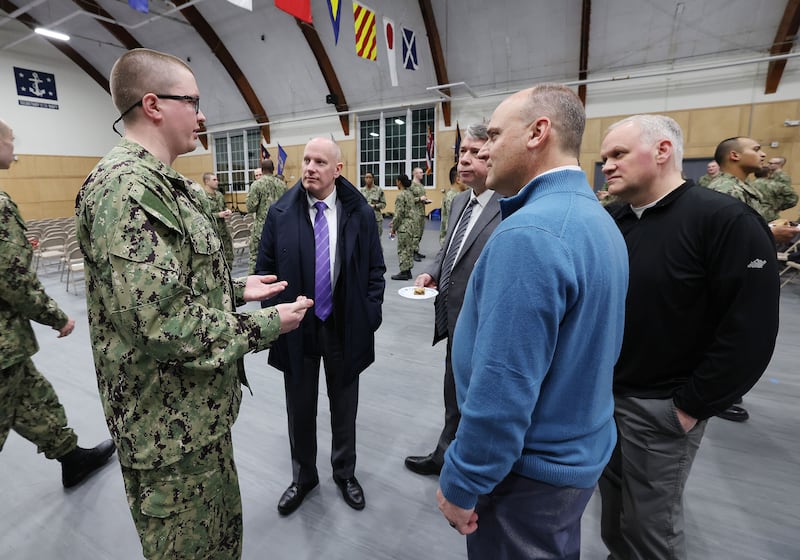 People talk after the Sailors’ Devotional at Naval Station Newport in Rhode Island.