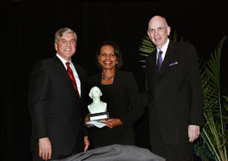 Former U.S. Secretary of State Condoleezza Rice, center, accepts 2012 Distinguished Public Service A