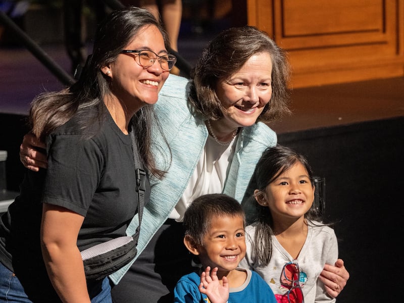 Primary General President Susan H. Porter poses for a photo with a BYU–Idaho student and her two children after the devotional.