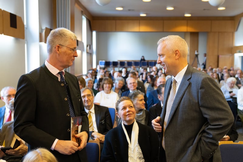 Elder Michael Cziesla — a General Authority Seventy and member of the Church’s Europe Central Area presidency — talks with an attendee inside a meetinghouse before the Vienna Austria Temple groundbreaking ceremony in Vienna, Austria, on Oct. 17, 2026.