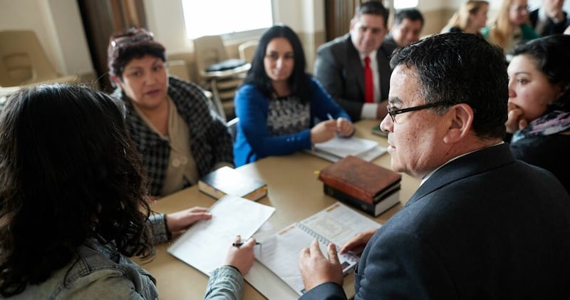 Teachers in a Latter-day Saint ward in Chile gather for a teacher council meeting.
