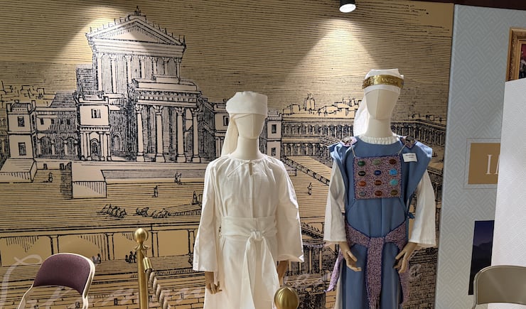 Before entering the tabernacle replica, visitors can see depictions of clothing temple workers and priests would have worn in the Old Testament, Farmington Utah North Stake center, June 18, 2026.