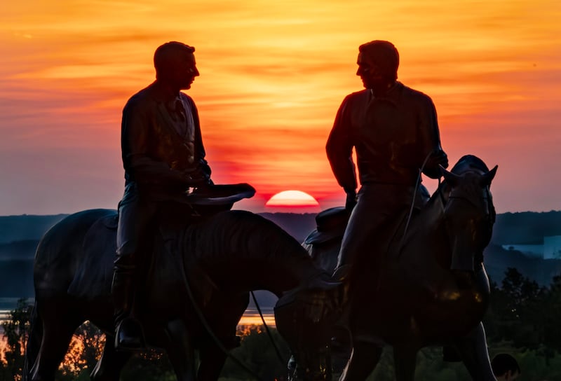 The Prophet Joseph Smith Jr. and his older brother Hyrum Smith are depicted in a statue on horseback at sunset in Nauvoo on Monday, June 5, 2023.