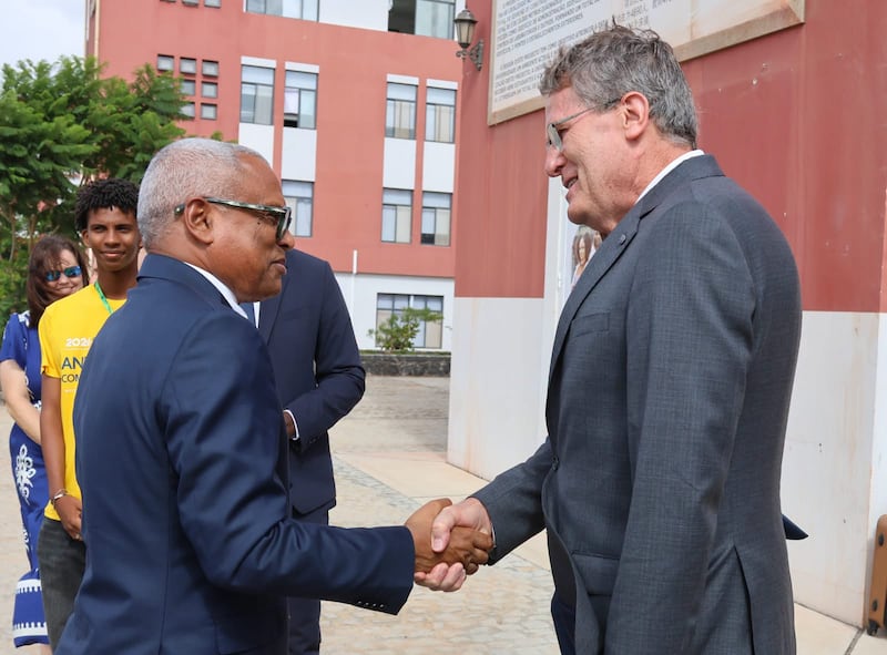 Elder Marcos A. Aidukaitis shakes hands with Cape Verde President José Maria Neves before the opening ceremony of this year's For the Strength of Youth conference in Praia, Cape Verde, Aug. 17, 2026.