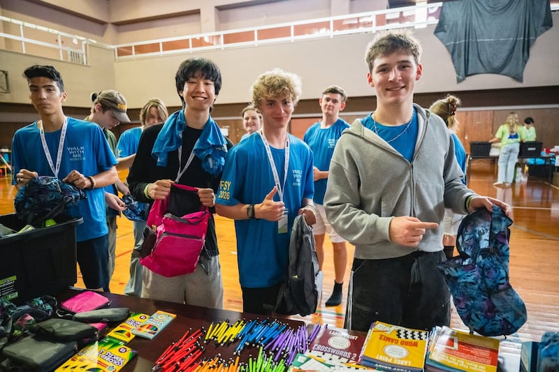 Young men and young women put together hygiene kits for families in need as part of a For the Strength of Youth conference for English-speaking youth in Okinawa, Japan, in June 2026.