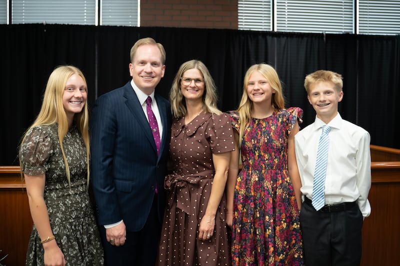 Deseret News publisher Burke Olsen, second from left, poses for a photo with his family after speaking at an Ensign College devotional in Salt Lake City, Sept. 8, 2026.