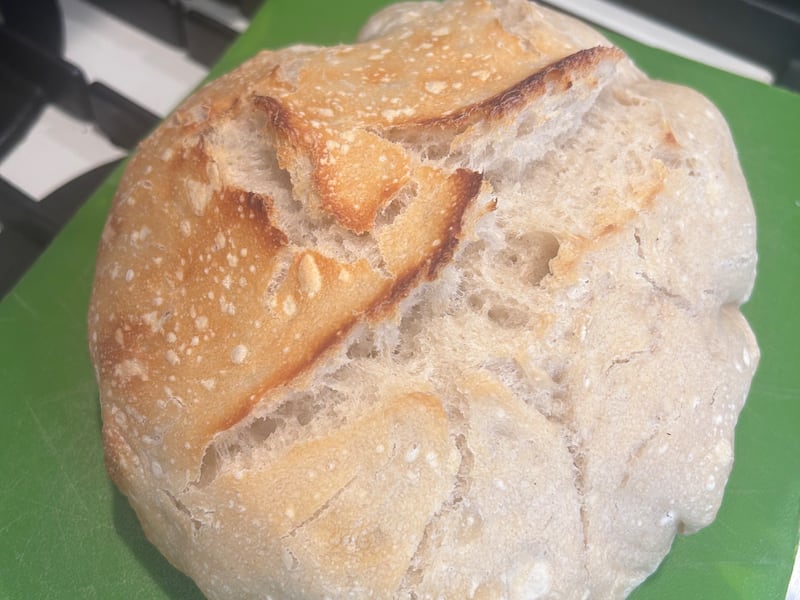 A loaf of sourdough bread rests on the counter after baking on May 16, 2026.
