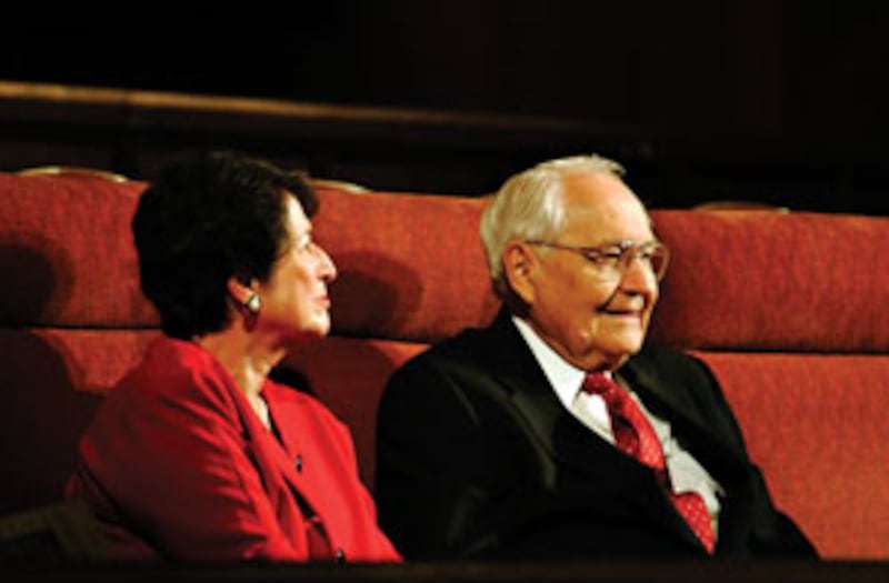 Barbara D. Perry and Elder L. Tom Perry of the Quorum of the Twelve Apostles listen to a string duet
