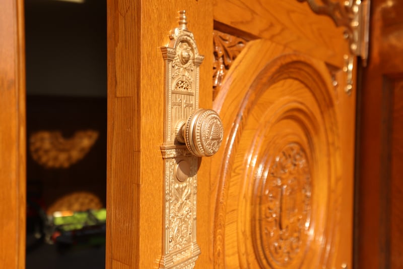 Iconic door handles and detailed woodwork shine on the Salt Lake Temple's renovated east door, which was installed on Tuesday, June 23, 2026.