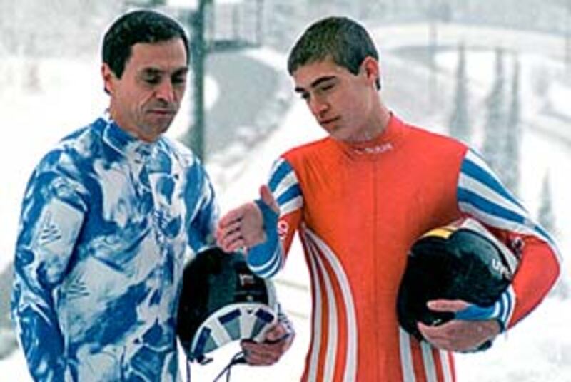 Chris Hoeger, right, reviews strategy for racing the Olympic Park luge course with his father, Werne