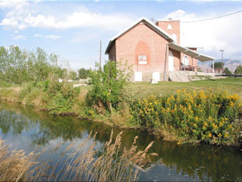 Old Oakley, Idaho, LDS meetinghouse is near canal where Elder David B. Haight was baptized by his fa