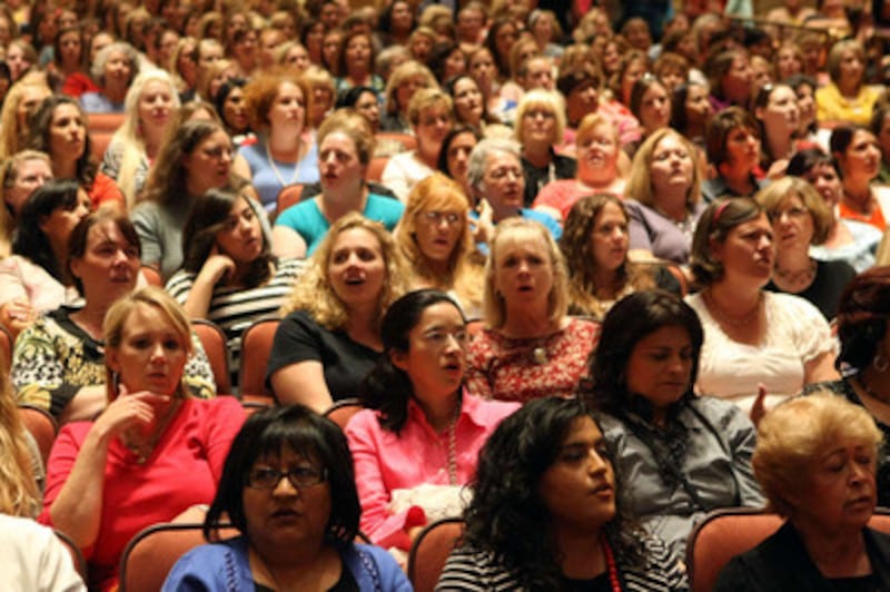 Women attend the General Relief Society Meeting in the Conference Center in Salt Lake City on Saturd