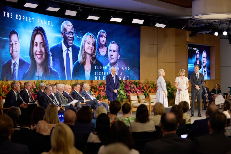 Elder Dale G. Renlund stands to the left watching a role play during the 2026 New Mission Leadership Seminar.