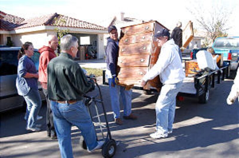 Members of the St. George Utah Green Valley Stake assist victims of recent flooding by organizing fu