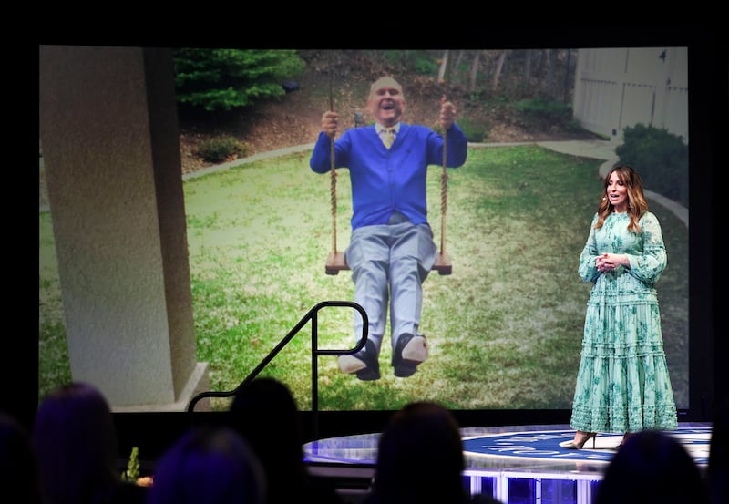 Irene Caso, media manager at The Church of Jesus Christ of Latter-day Saints, speaks at the BYU Women’s Conference in Provo, Utah, on Thursday, May 4, 2023. A photograph of President Russell M. Nelson is projected.