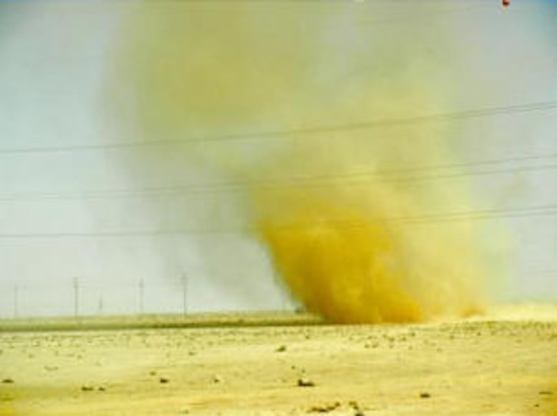 Dust storm can be seen from the Zaatari refugee camp in Jordan. The Church has provided gravel to he